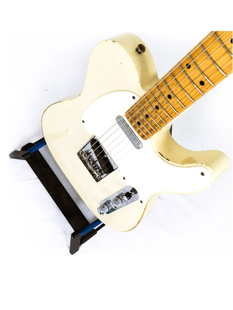A white 2006 Fender Custom Shop 55 Tele guitar with a black pick guard, expertly crafted by Chris Fleming.