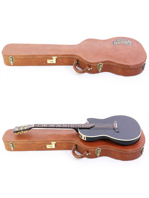 A white background showcases two guitars in a case, including a 1998 Gibson Chet Atkins SST from the USA.
