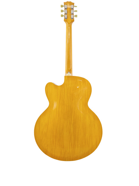 A yellow Sutton Archtop guitar from the 1970s set against a clean white background.
