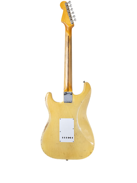 A yellow and white 1959 Fender Stratocaster guitar, highlighting its vintage appeal and iconic American craftsmanship.