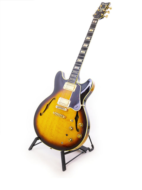 An Ibanez Artist AS200 guitar from 1981 displayed on a stand, featuring a striking design against a plain white backdrop.