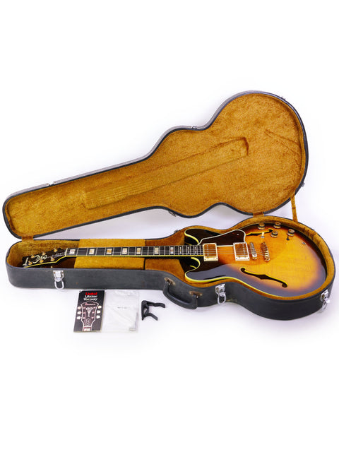 An Ibanez Artist AS200 guitar from Japan, 1981, displayed with its case and various accessories.