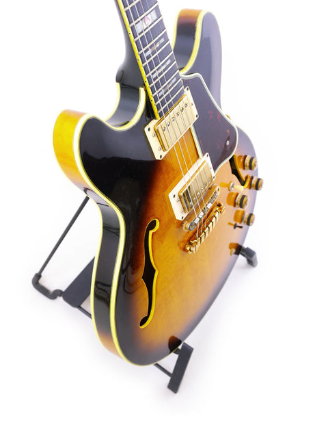 An Ibanez Artist AS200 guitar from Japan, 1981, elegantly positioned on a stand, highlighting its classic features.