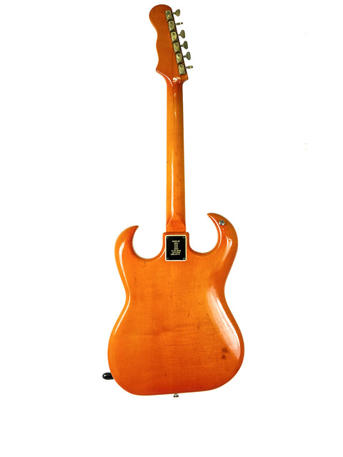 An eye-catching orange guitar featuring a stylish neck, highlighting the craftsmanship of a 2012 USA Warmoth Strat Partscaster.