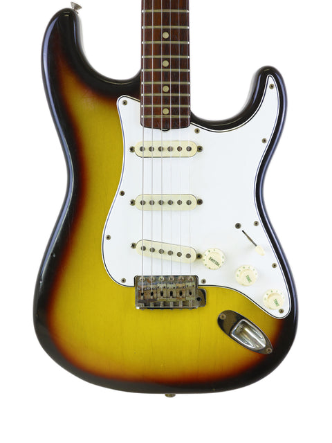 Beautiful sunburst finish on a 1965 Fender Custom Shop Stratocaster, representing timeless style and exceptional quality.
