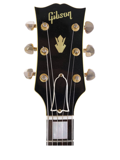 Black Gibson Les Paul Custom Shop guitar, showcasing its classic design and craftsmanship, alongside a 1959 Gibson ES-5 Switchmaster.