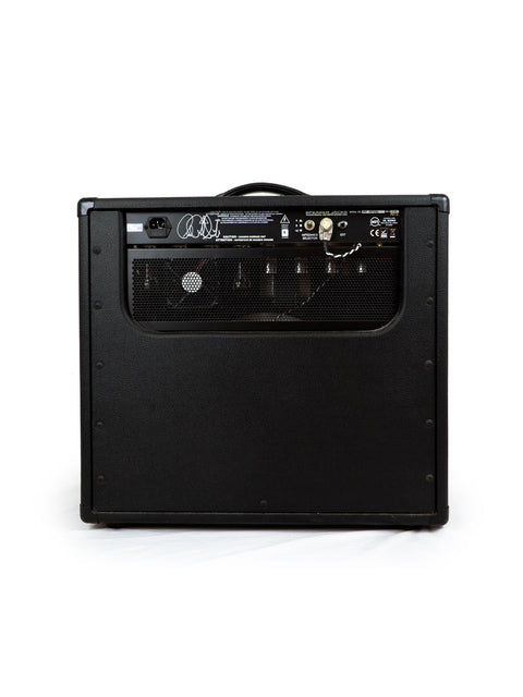 Black PRS Paul Reed Smith 30 Combo Amp on a white background, showcasing its sleek design and quality craftsmanship.