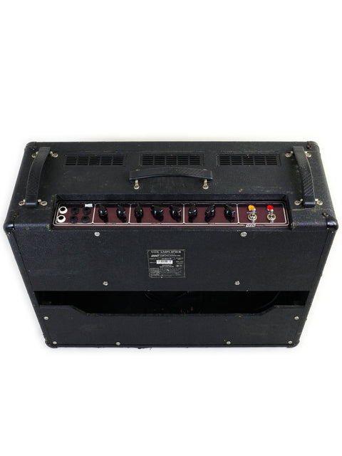 Black Vox AC30 6TB Combo Amplifier (1997) with a vibrant red and white logo, perfect for any music lover.