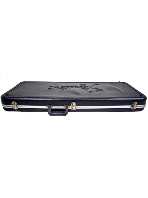 Black case with a gold logo, specifically made for the 2004 Fender American Deluxe Stratocaster guitar.