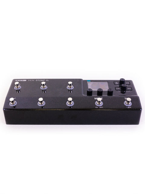 Black electronic pedal board with five knobs, representing the 2022 Line 6 HX STOMP XL Guitar Processor model.