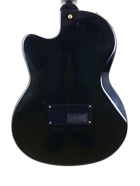 Black guitar featuring a gold headstock, representing the 1998 Gibson Chet Atkins SST made in the USA.