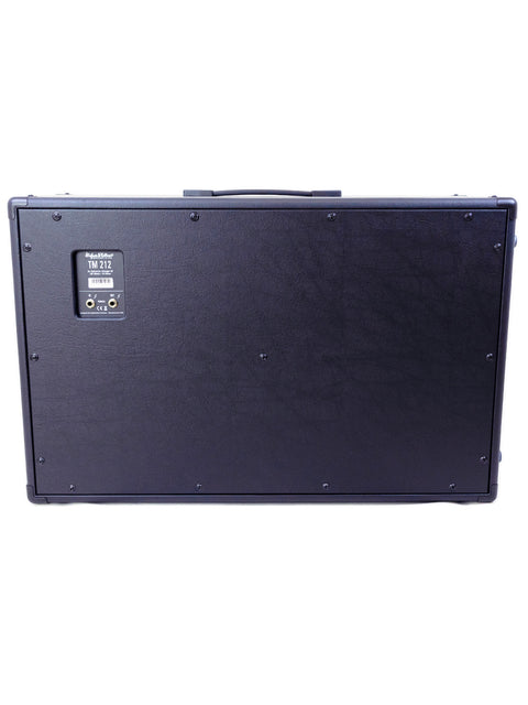 Black speaker box featuring a metal top cover, representing the Hughes & Kettner TM 212 model made in Germany, 2021.