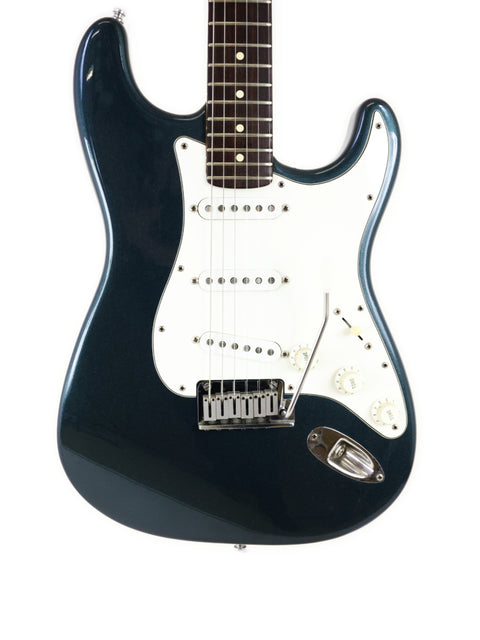 Blue Fender Custom Shop Stratocaster electric guitar, Strat Plus Deluxe model from 1989, highlighting its craftsmanship and style.