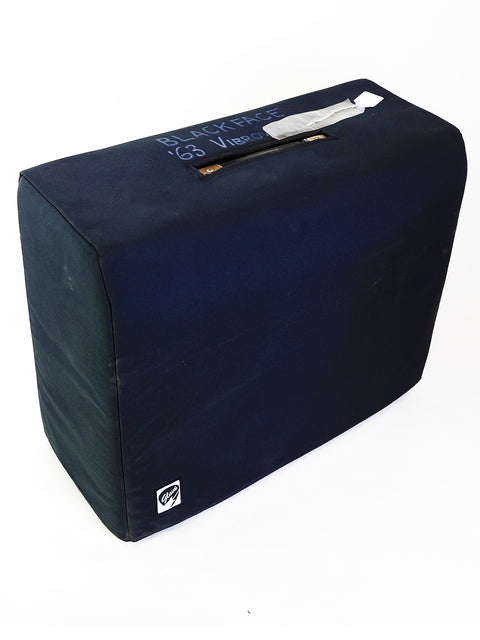 Blue protective cover for a 1964 Fender Vibroverb guitar amplifier, highlighting its vintage blackface aesthetic.