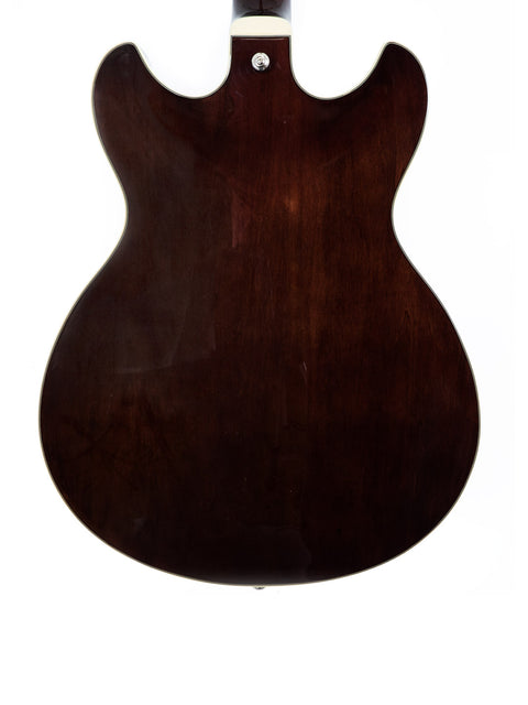 Brown Ibanez Artcore AS73 FM guitar with a white pickguard, highlighting its elegant semi-hollow body style from 2019.