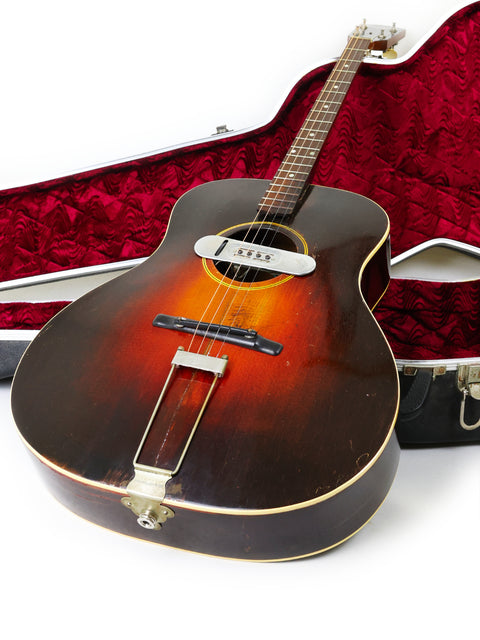 Classic 1934 Gibson TG50 Tenor Guitar in its case, ideal for vintage lovers, showcased against a clean white backdrop.