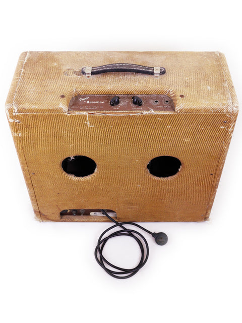 Classic 1952/53 Fender Bassman amplifier with a microphone and cord, embodying the essence of vintage sound.