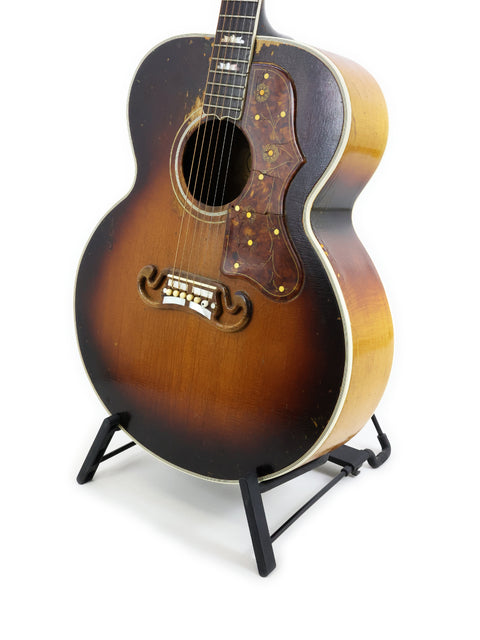 Classic 1955 Gibson J-45 acoustic guitar, representing vintage American craftsmanship and timeless musical heritage.