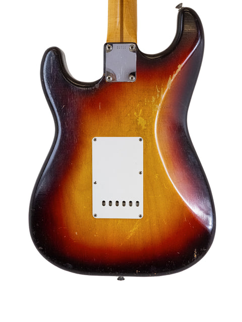 Classic 1958 Fender Stratocaster guitar in sunburst finish, representing iconic American craftsmanship and vintage aesthetics.