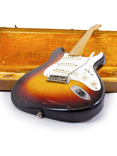 Classic 1958 Fender Stratocaster guitar resting in a wooden case, emphasizing its timeless style and vintage heritage.