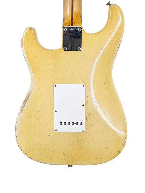 Classic 1959 Fender Stratocaster guitar in yellow with a white pickguard and maple neck, highlighting its vintage appeal.