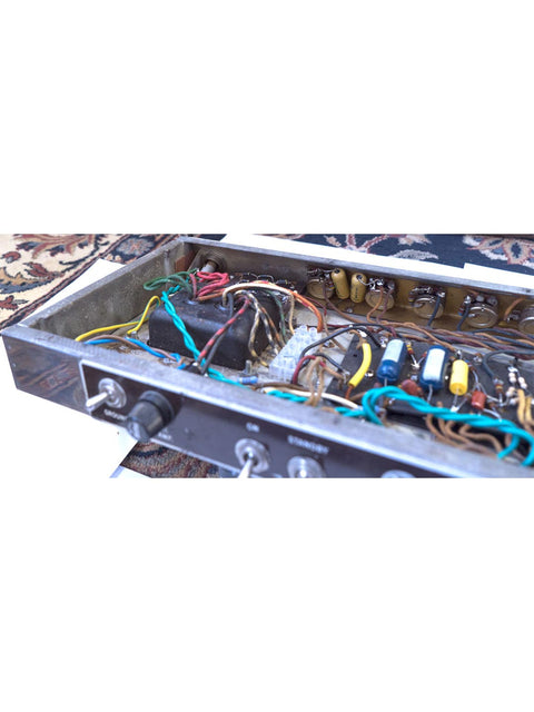 Classic 1961 Fender 6G12A Concert Amp, highlighting its vintage charm with wires and an iconic electronic instrument design.