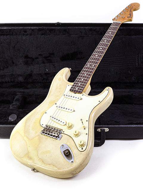 Classic 1968 Fender Stratocaster in white, highlighting its wooden body and neck, a true vintage gem for guitar lovers.