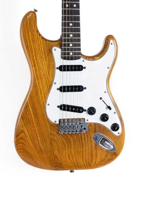 Classic 1979 Fender Stratocaster guitar with a wooden body and a white pickguard.