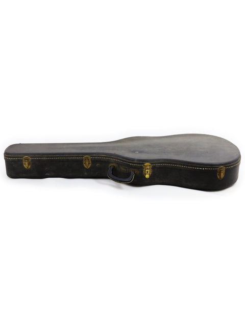 Classic black guitar case for a 1963 Gibson ES-335, isolated on a white background, showcasing its elegant design.