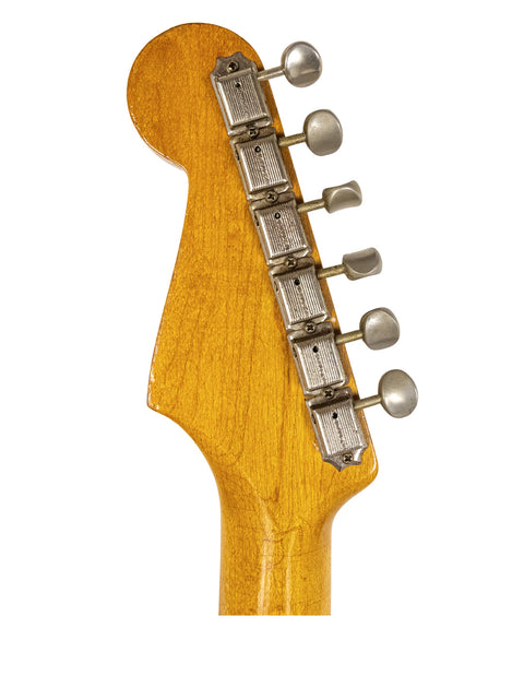 Close-up image of a 1957 USA Fender Stratocaster neck, highlighting the rich Dakota Red color and craftsmanship.