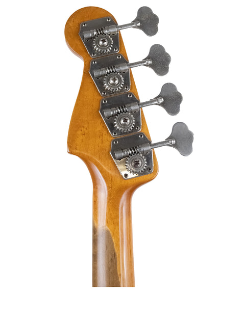 Close-up image of a four-string vintage Fender Precision Bass guitar from 1958/59, emphasizing its unique design and heritage.