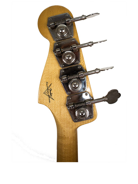 Close-up image of a guitar head from a 2001 Fender Custom Shop ‘62 Jazz Bass Reissue, highlighting four tuning knobs.