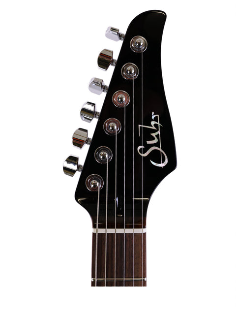 Close-up image of a guitar headstock showing "sli," belonging to the Suhr Pete Thorn Signature, made in the USA, 2021.