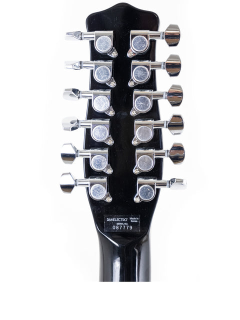 Close-up image of the headstock from a 2020 Danelectro DC59 12 String electric guitar, emphasizing its elegant design and quality.