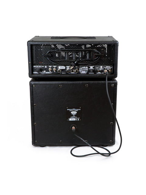 Close-up of a black EVH 5150 III amp head with a cord connected, highlighting its robust build and professional features.