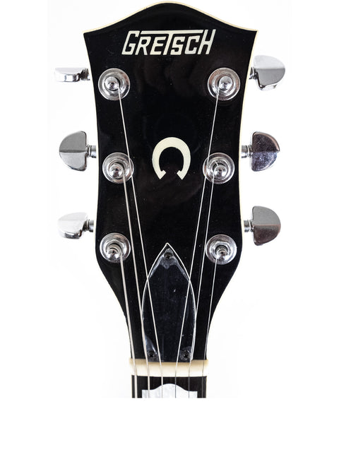 Close-up of the headstock of a 1989 Gretsch Duo Jet 6128, emphasizing its iconic shape and vintage appeal.