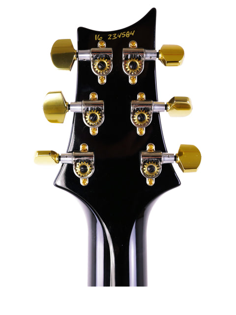 Close-up of the headstock on a 2016 PRS McCarty 594 electric guitar, featuring its distinctive shape and elegant finish.