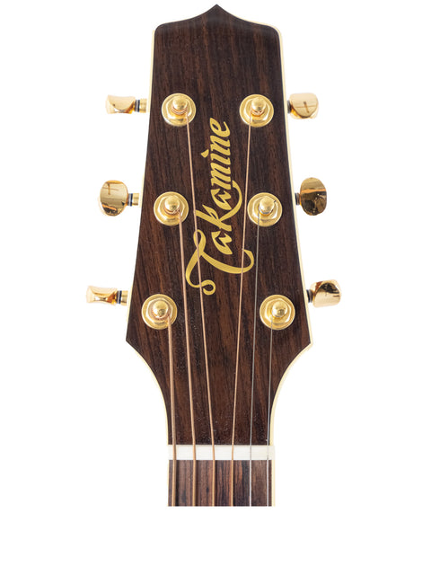 Close-up of the headstock on a Takamine TSP138C TB guitar, showcasing the "Talman" logo from Japan, 2020 model.
