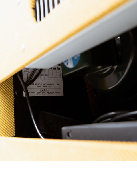Detailed close-up of a yellow and black electrical box, highlighting its unique features and color contrast.