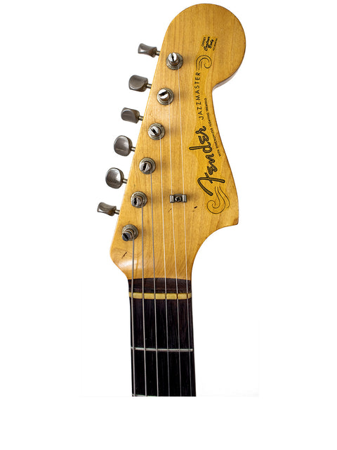 Detailed view of a 1960 USA Fender Jazzmaster guitar headstock showcasing its distinctive logo.
