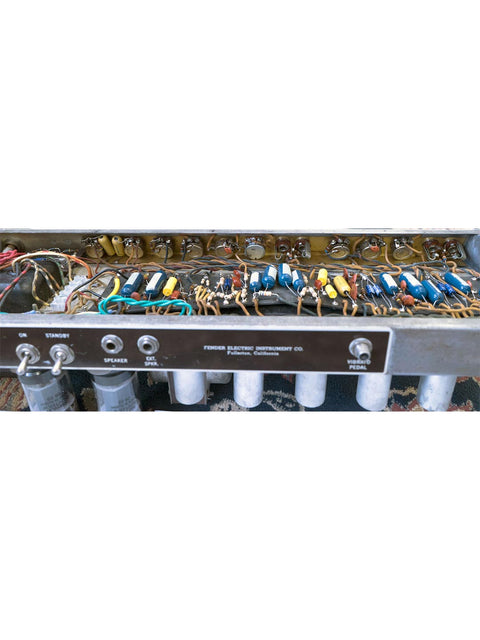 Detailed view of a 1961 Fender 6G12A Concert Amp, highlighting its vintage electronics and iconic features.