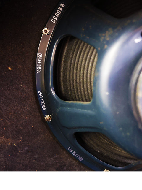 Detailed view of a 1964 Fender Vibroverb amplifier featuring the word "speaker" on its front, highlighting its vintage style.