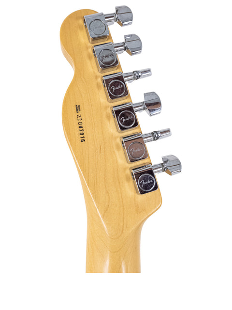 Detailed view of a 2002 Fender American Standard Telecaster neck, highlighting the craftsmanship and fret design.