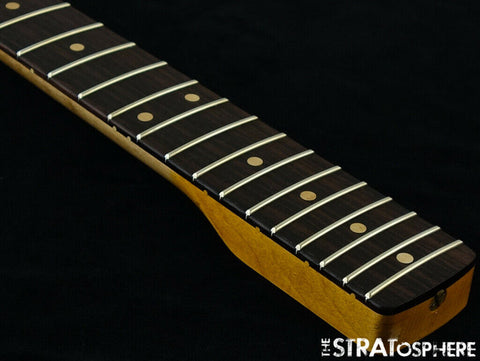 Detailed view of a Fender '60s Strat Partscaster with a wooden fretboard, showcasing its Olympic White color.