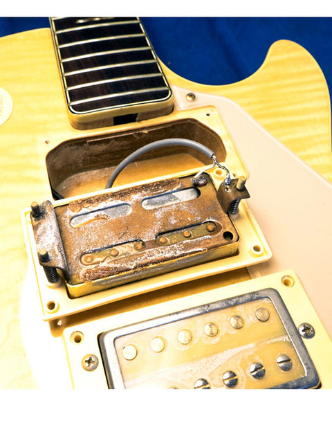 Detailed view of a Univox Gimmie U-1988 guitar, highlighting the pickup and its cover, made in Japan, 1974-75.