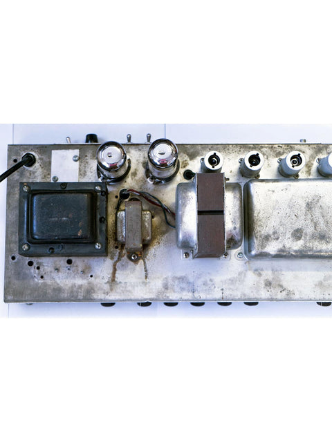 Detailed view of a metal box with assorted components from a 1961 Fender 6G12A Concert Amp.