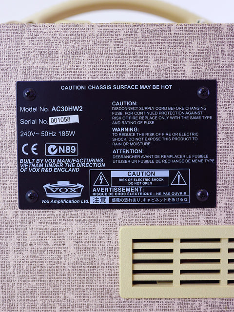 Detailed view of the Vox AC30HW2 label on a speaker, highlighting its 2013 model features and craftsmanship.