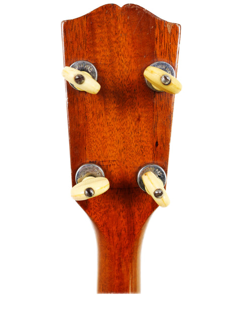 Detailed view of the head of a Gibson TG50 Tenor Guitar, highlighting its classic features and rich history from 1934.