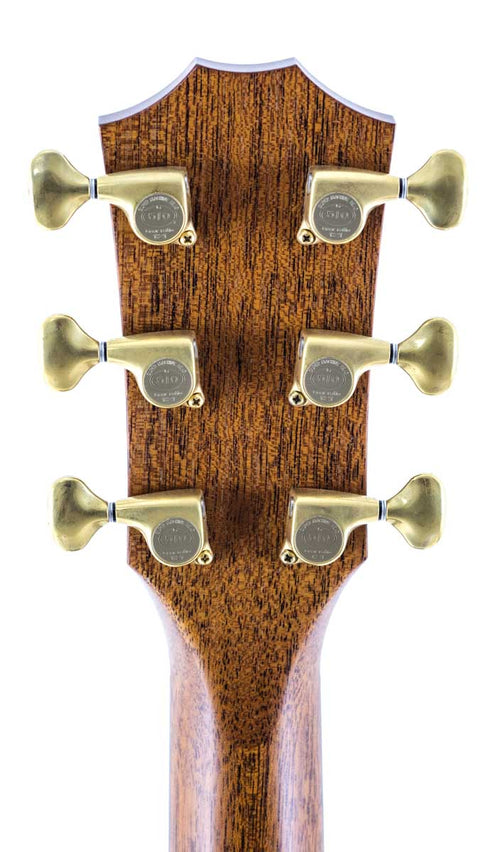 Detailed view of the headstock from a 2011 Taylor Custom GS Baritone 6 acoustic guitar, highlighting its unique features.
