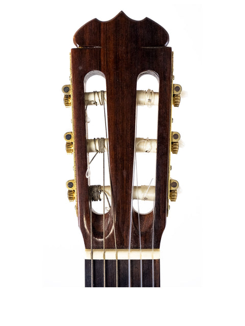 Detailed view of the headstock of a 1987 K Yairi YC90 Concert Classical Guitar, highlighting its craftsmanship and tuning pegs.